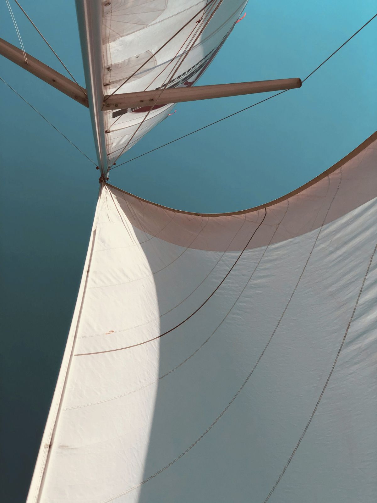 Sail detail against teal sky
